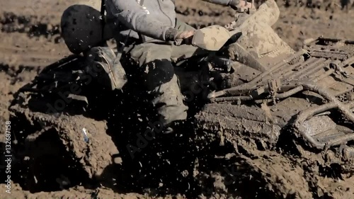 4x4 offroad vehicle is trying to cross the muddy area 