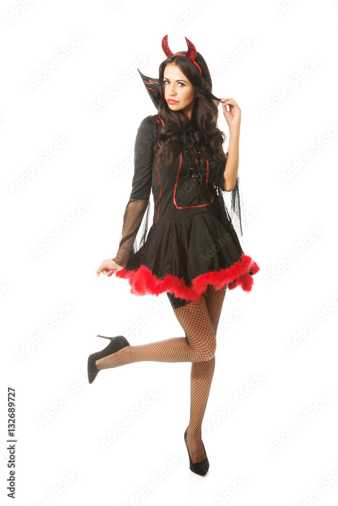 Full length devil woman standing with bended knee Full length devil woman standing with bended knee
