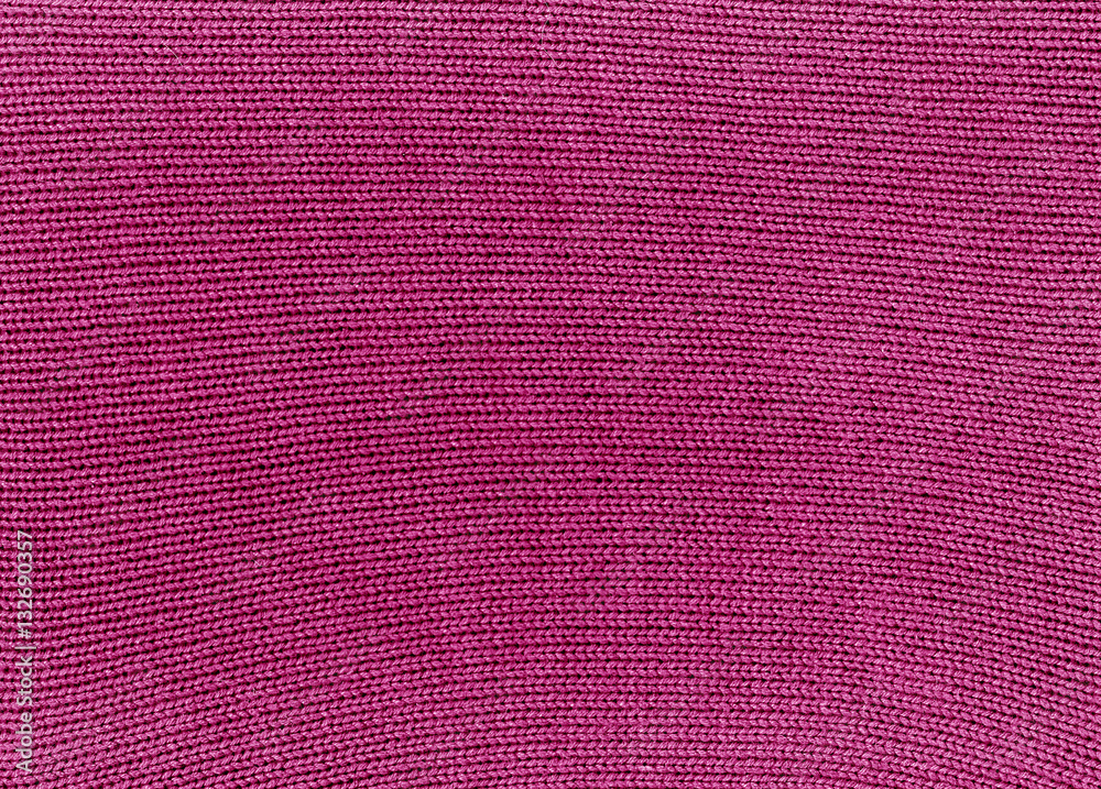 Fototapeta premium Pink knitted material texture.