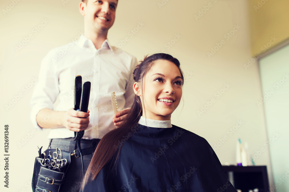 happy woman with stylist making hairdo at salon happy woman with stylist making hairdo at salon
