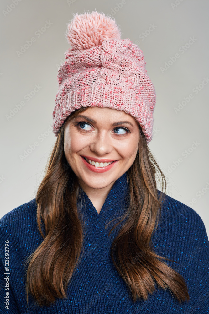 smiling young woman wearing warm winter scarf looking side. smiling young woman wearing warm winter scarf looking side.