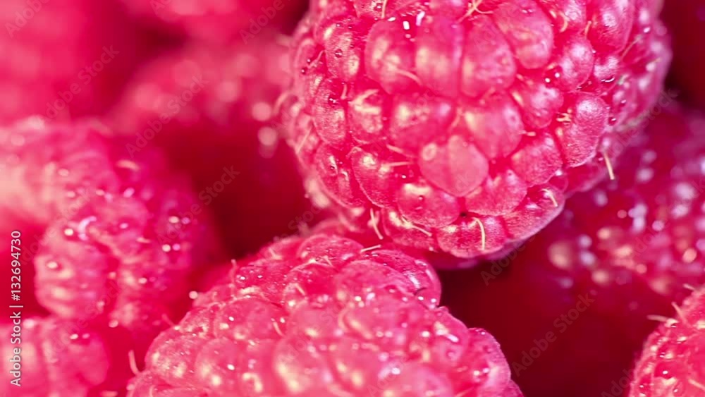 Juicy fresh raspberries rotating. Raspberries fruit background. Macro shot.