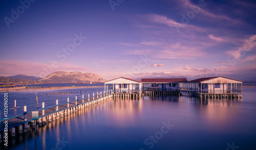 Small fishing houses on stilts on the lake Mesologgi, Greece © gatsi