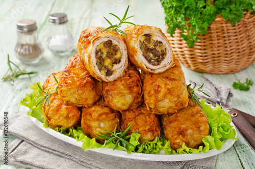 Crisp potato cutlets with meat, mushrooms and cheese photo