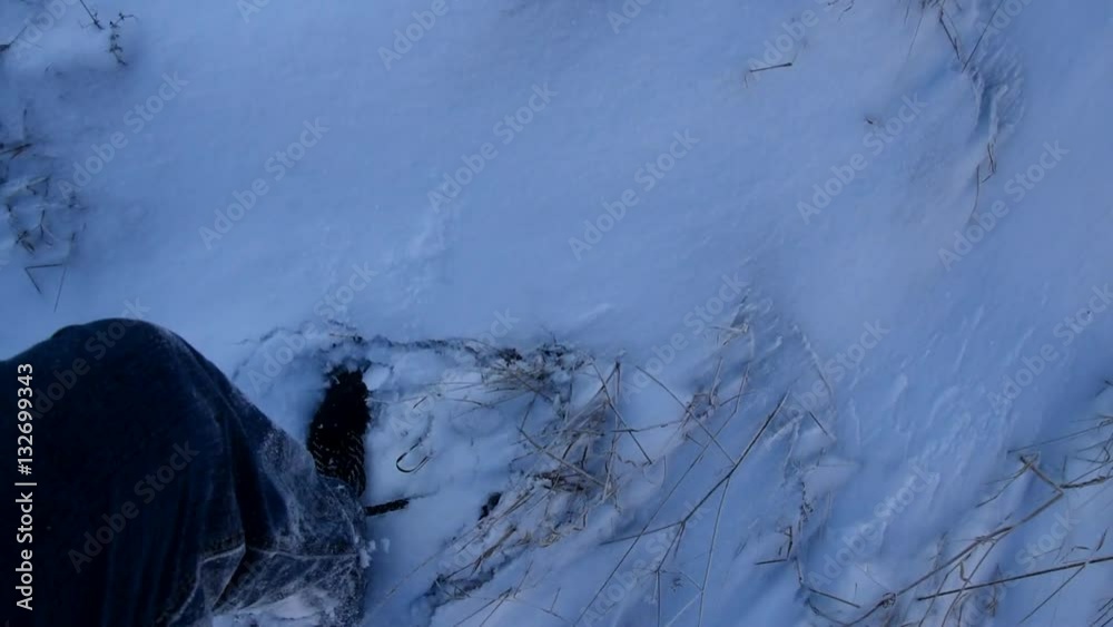 Man Goes snow, shot to his feet.