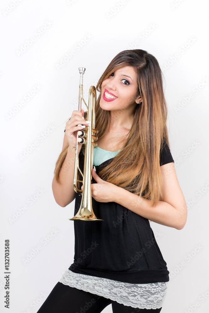 Funny beautiful woman holding trumpet isolated Funny beautiful woman holding trumpet isolated