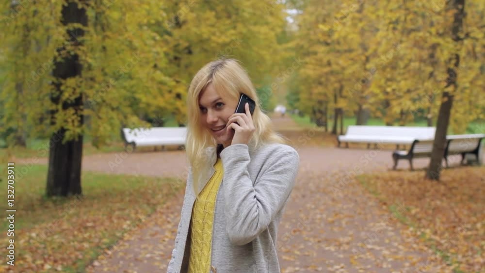 Girl Talking on the Phone in the Park