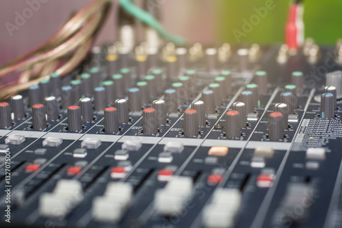 Selective focus on the audio mixer in the control room for meetings / workshops.