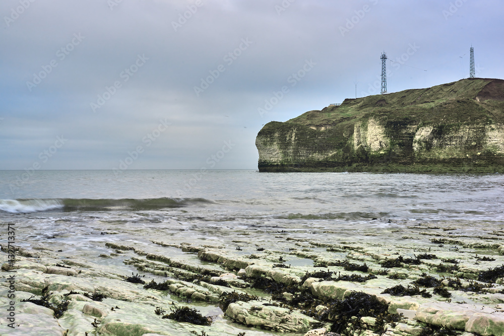 A view of the beach and surrounding rock at the North Landing at Flamborough Head on the north Yorkshire coast