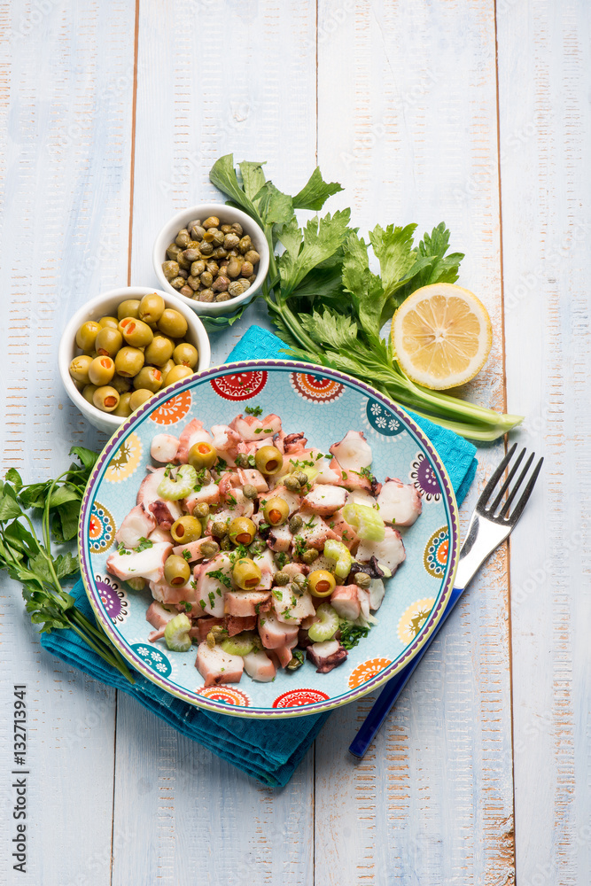 octopus salad with capers celery and green olives and lettuce
