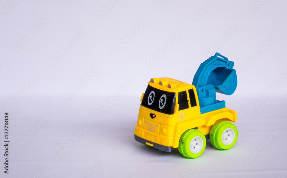 Colorful plastic toy truck on white background Colorful plastic toy truck on white background