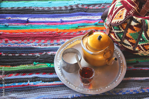 Bedouin tea / Featuring Bedouin Tea, Sugar and a colorful handmade backbag in a colorful Badawy tent /  photo