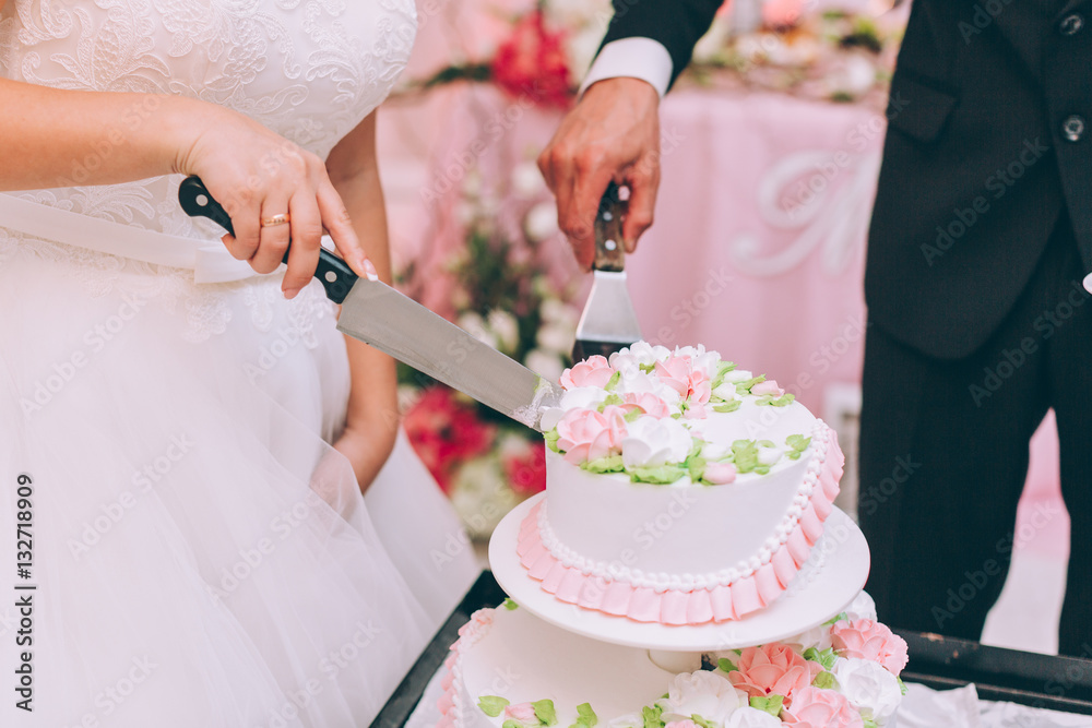 Wedding ceremony. Bride and groom cutting cake. Wedding ceremony. Bride and groom cutting cake.