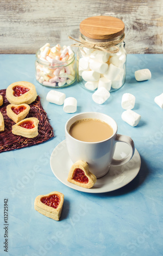 cocoa with marshmallows and a cookie heart. Selective focus.   photo