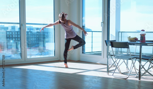 Dancing in room filled with sunlight