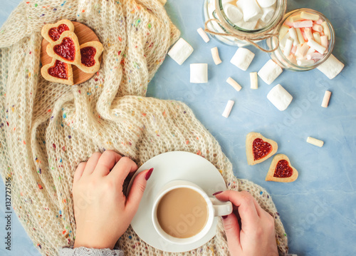 cocoa and cookies heart in the hands of lovers. Selective focus.   photo