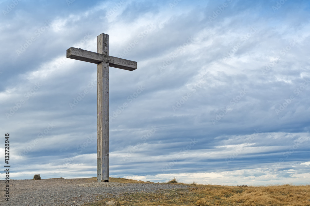 Wooden cross on mountain peak
