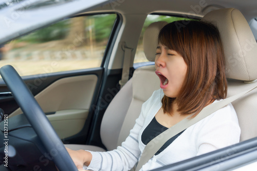 Closeup portrait sleepy, yawn, close eyes young woman driving