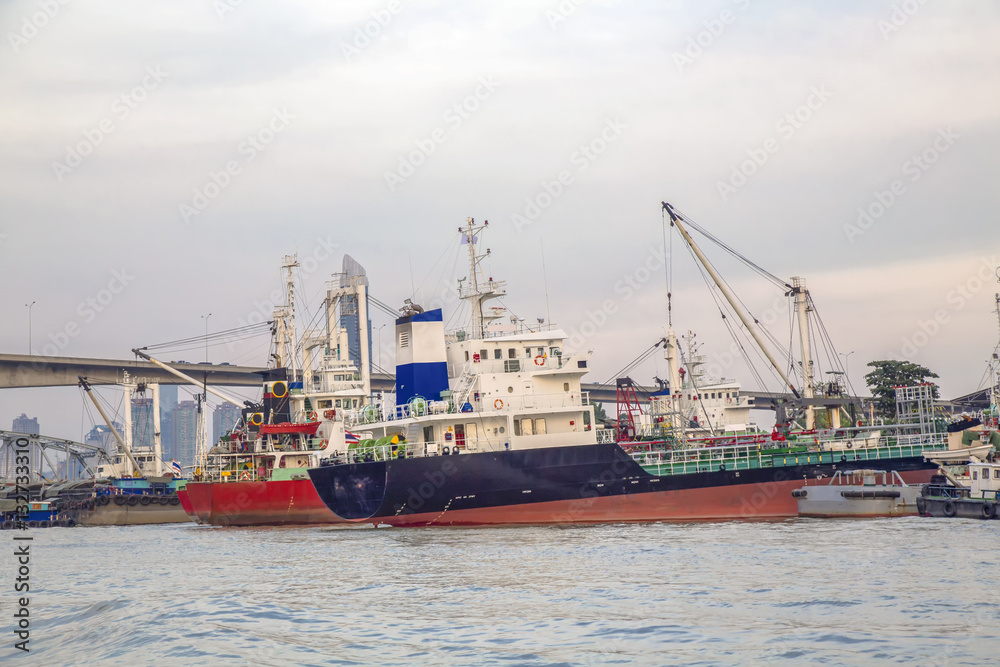 Logistic concept,Cargo ships and tankers. The harbor to await the maintenance area Shipyard.