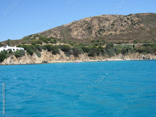 вид с моря на побережье острова Сардиния  © yulanaom