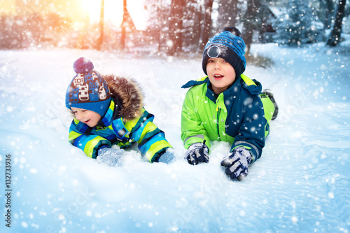Children playing in snow at snowfall