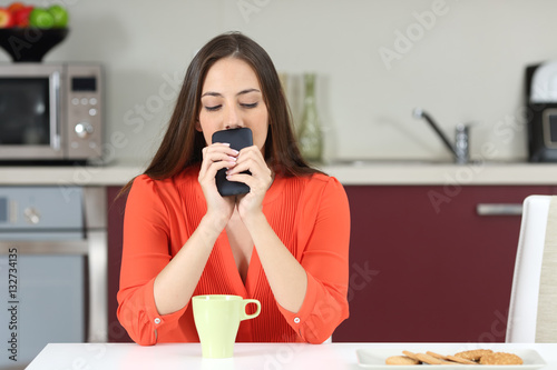 Photos Doubtful woman wondering if she must call on phone
