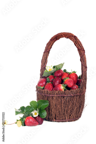 Wicker basket with a ripe strawberry. Isolated on white backgrou