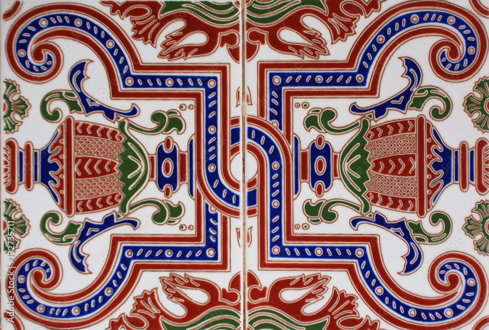 Naklejka premium Detail of the traditional tiles from facade of old house. Decorative tiles