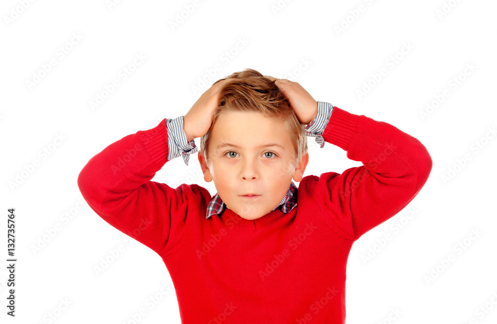 Surprised child with red jersey and his hands on the head Surprised child with red jersey and his hands on the head