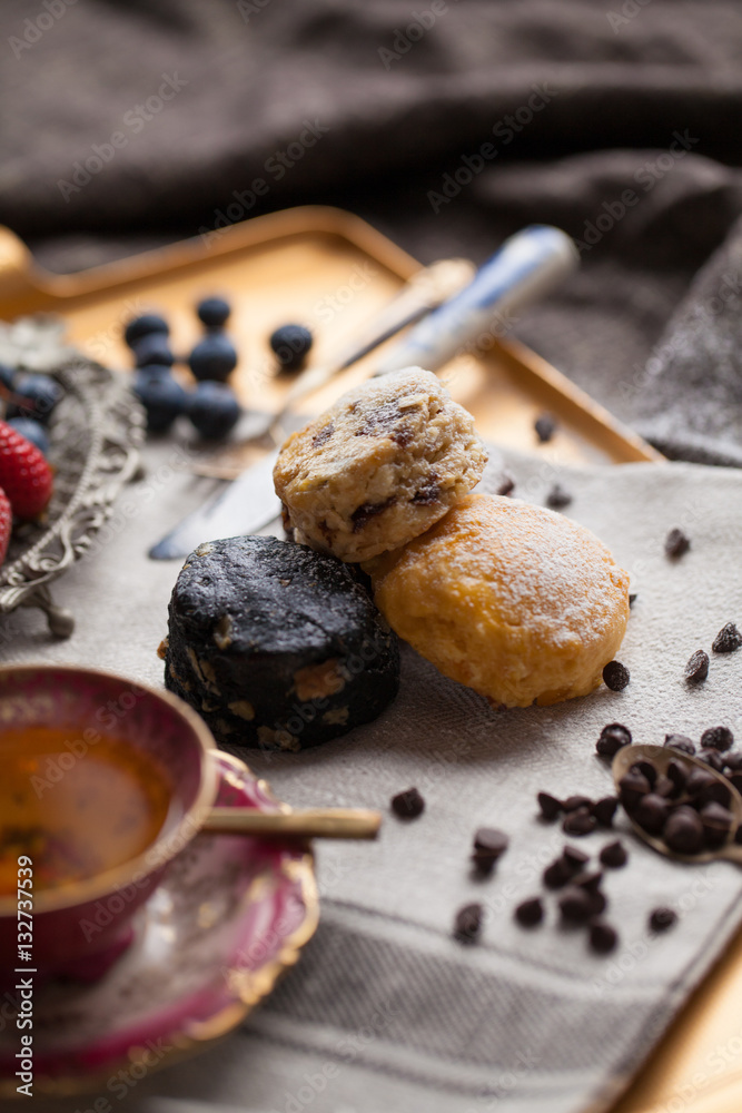 Mix flavour of scone biscuit decorate with chocolate ship and fresh strawberry and blueberry Mix flavour of scone biscuit decorate with chocolate ship and fresh strawberry and blueberry