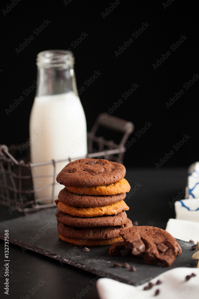 Chocolate ship soft cookies pile up decorate with chocolate ship and milk in a bottle. Chocolate ship soft cookies pile up decorate with chocolate ship and milk in a bottle.