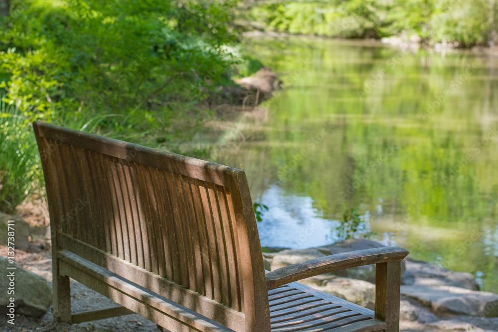 Calm. Peaceful sitting spot with bench and reflective waters at a botanical garden. Sarah P. Duke. Durham, NC
