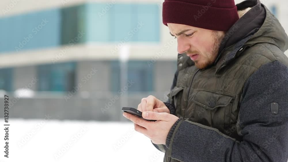 Man writes sms winter in the city Man writes sms winter in the city
