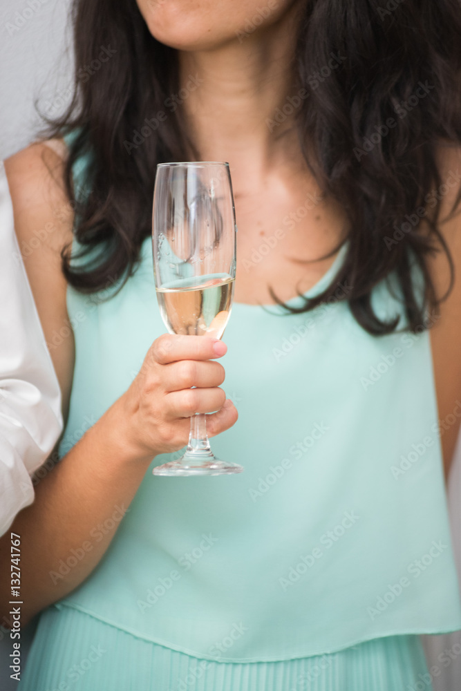 Woman holding glass champagne or sparkling wine Woman holding glass champagne or sparkling wine