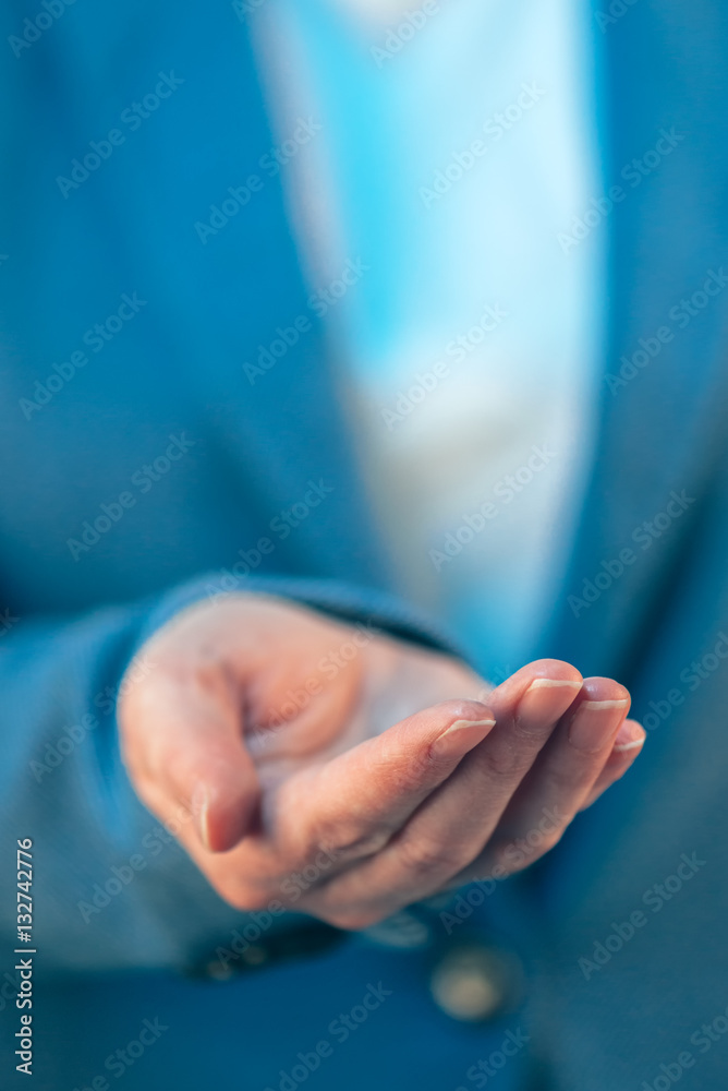 Businesswoman with open palm of her hand