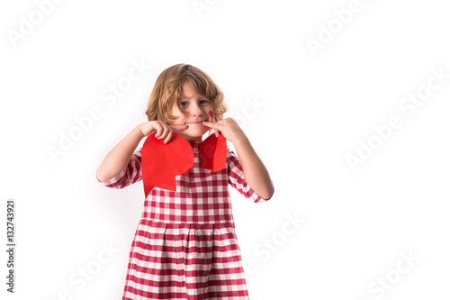 Girl child in  plaid dress  with  broken heart on  white backgro