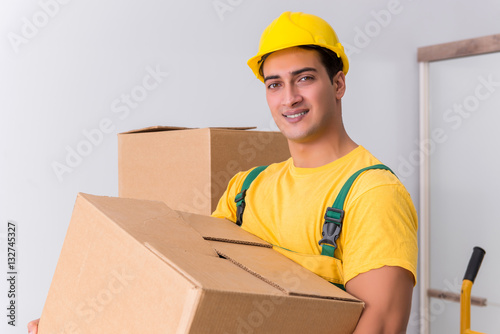 Transportation worker delivering boxes to house