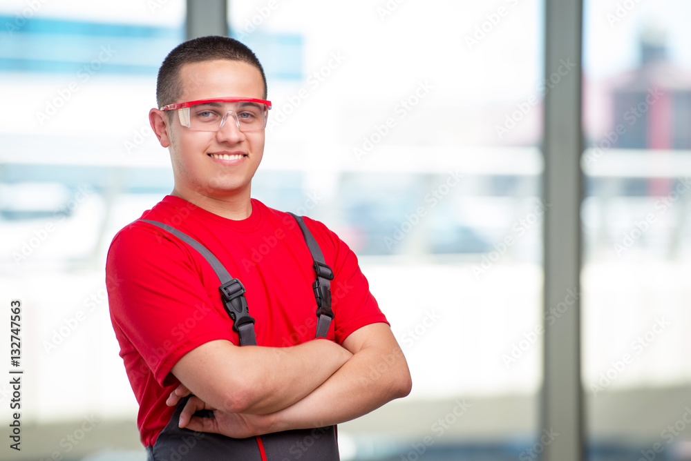 Young furniture carpenter in industrial concept Young furniture carpenter in industrial concept