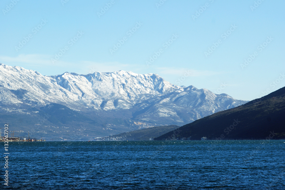 The sea and the snow-covered slopes The sea and the snow-covered slopes