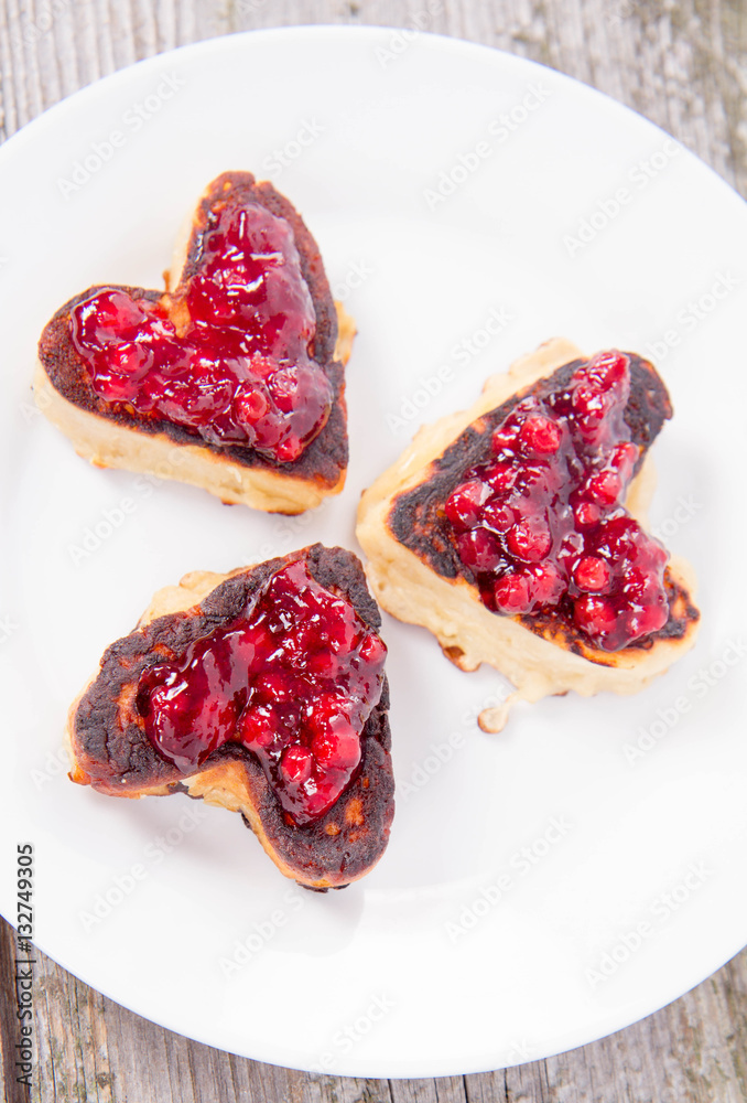 Heart shaped pancakes with cowberry jam Heart shaped pancakes with cowberry jam