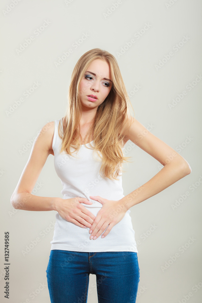 Girl suffering from stomach pain Girl suffering from stomach pain