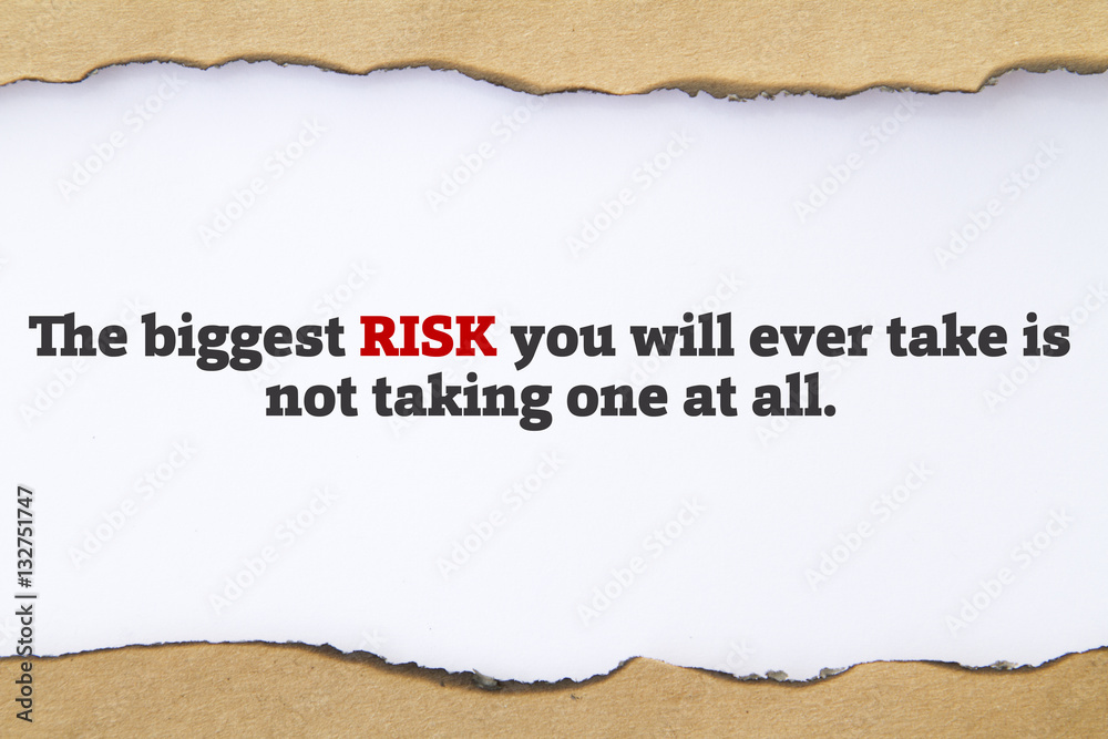 The biggest risk you will ever take is not taking one at all message written under torn paper.