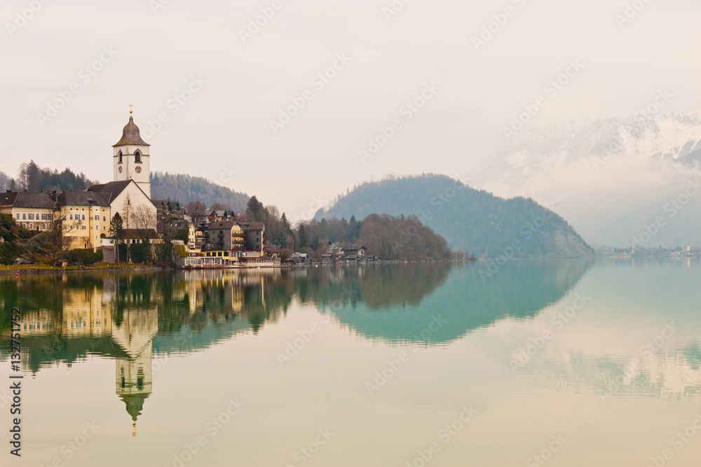 View of St. Wolfgang chapel and the village of St. Wolfgang at Wolfgangsee lake, Austria View of St. Wolfgang chapel and the village of St. Wolfgang at Wolfgangsee lake, Austria