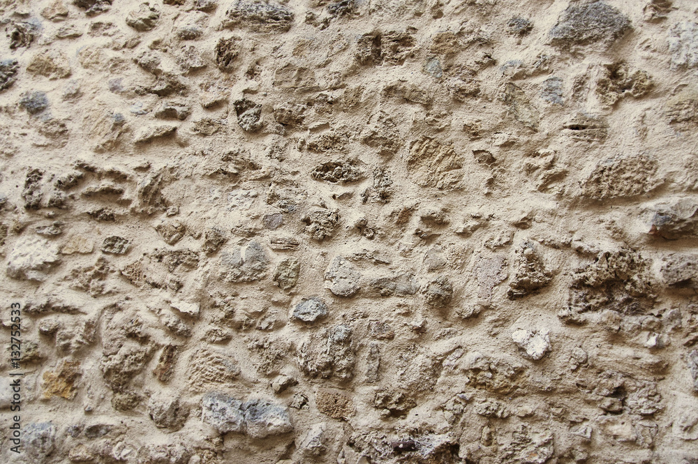 Old beige stone wall background texture Old beige stone wall background texture