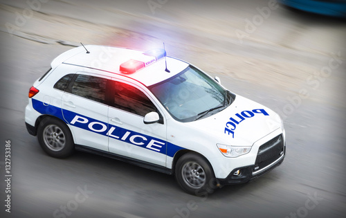 Police car in motion blur with flashing lights
