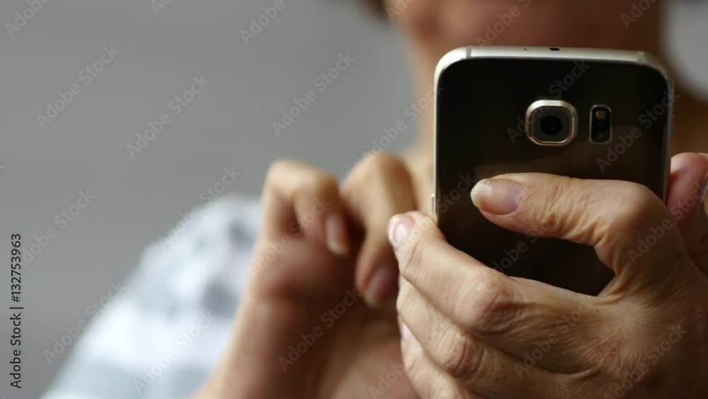 Elderly Woman Browsing Online On Smartphone, White Background, Close Up Elderly Woman Browsing Online On Smartphone, White Background, Close Up