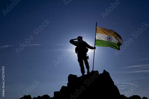 Soldier on top of the mountain with the Indian flag