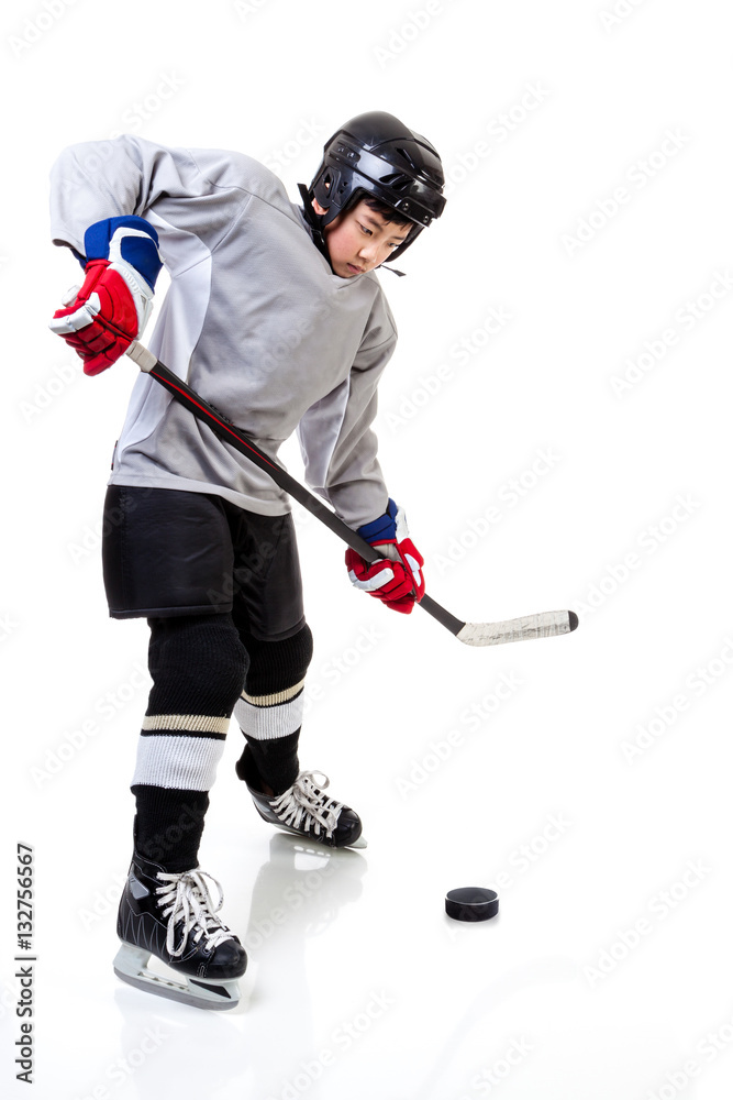 Junior Ice Hockey Player Isolated on White Background Junior Ice Hockey Player Isolated on White Background