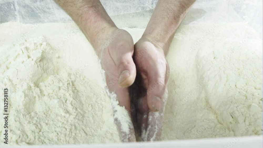 Chef's hands in the white flour Chef's hands in the white flour