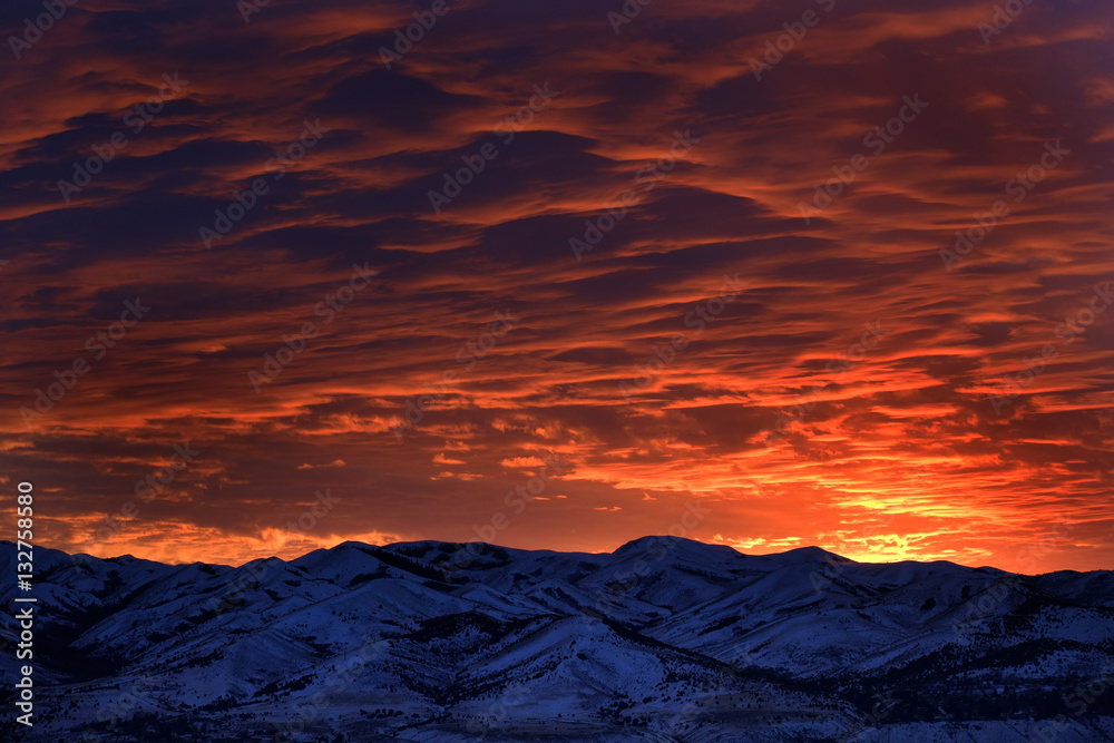 Sunset with Mountains in Wilderness Sky Clouds
